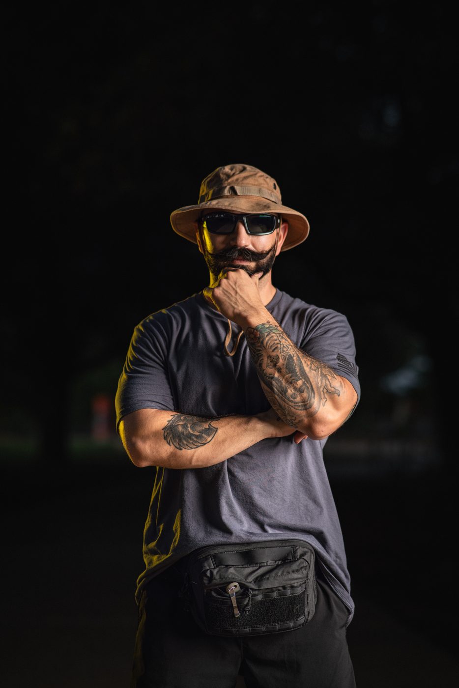 Men's tactical-style portrait with night lighting